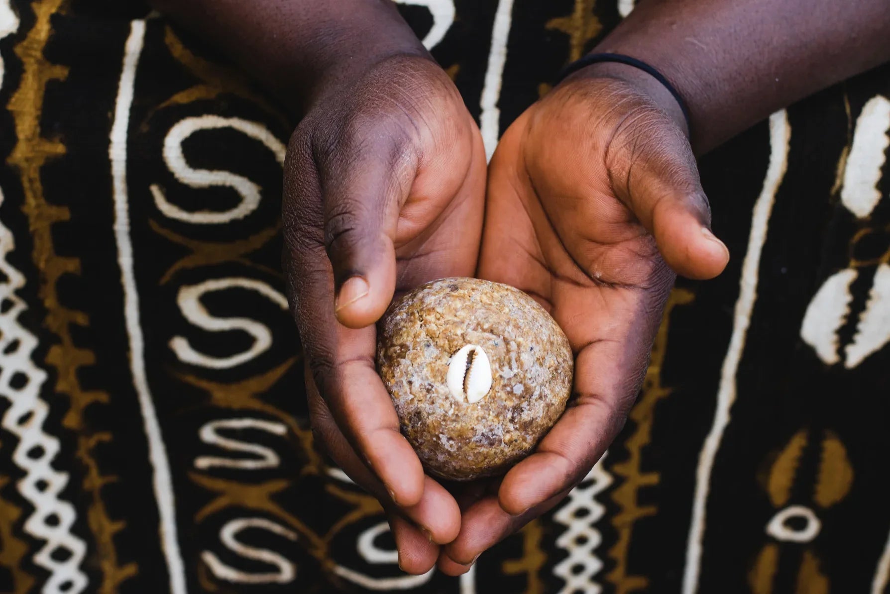 Hands holding traditionally prepared Ankhkasta soap