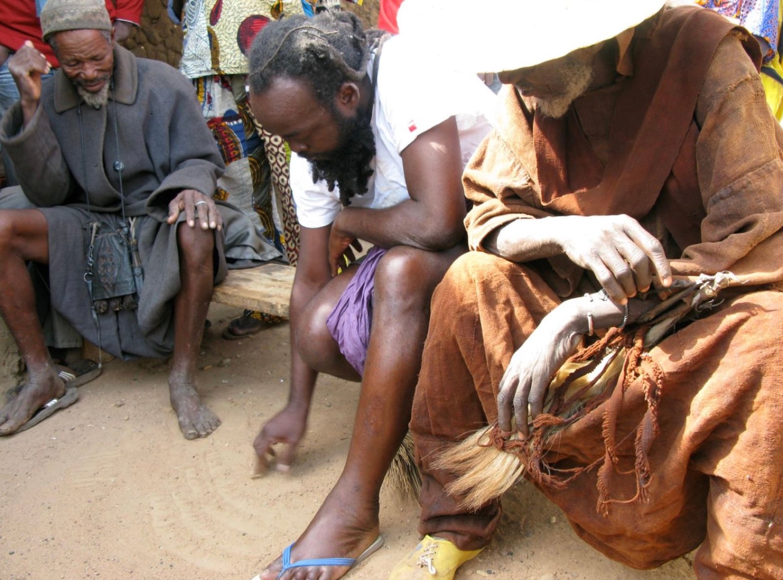 Indigenous priests working together on the ground