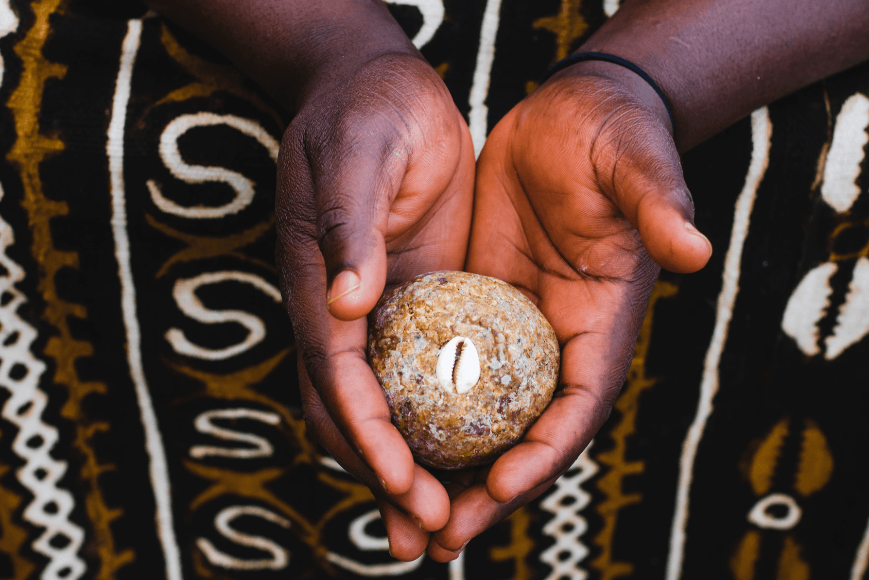 Hands holding a traditional Ankhkasta cleansing soap