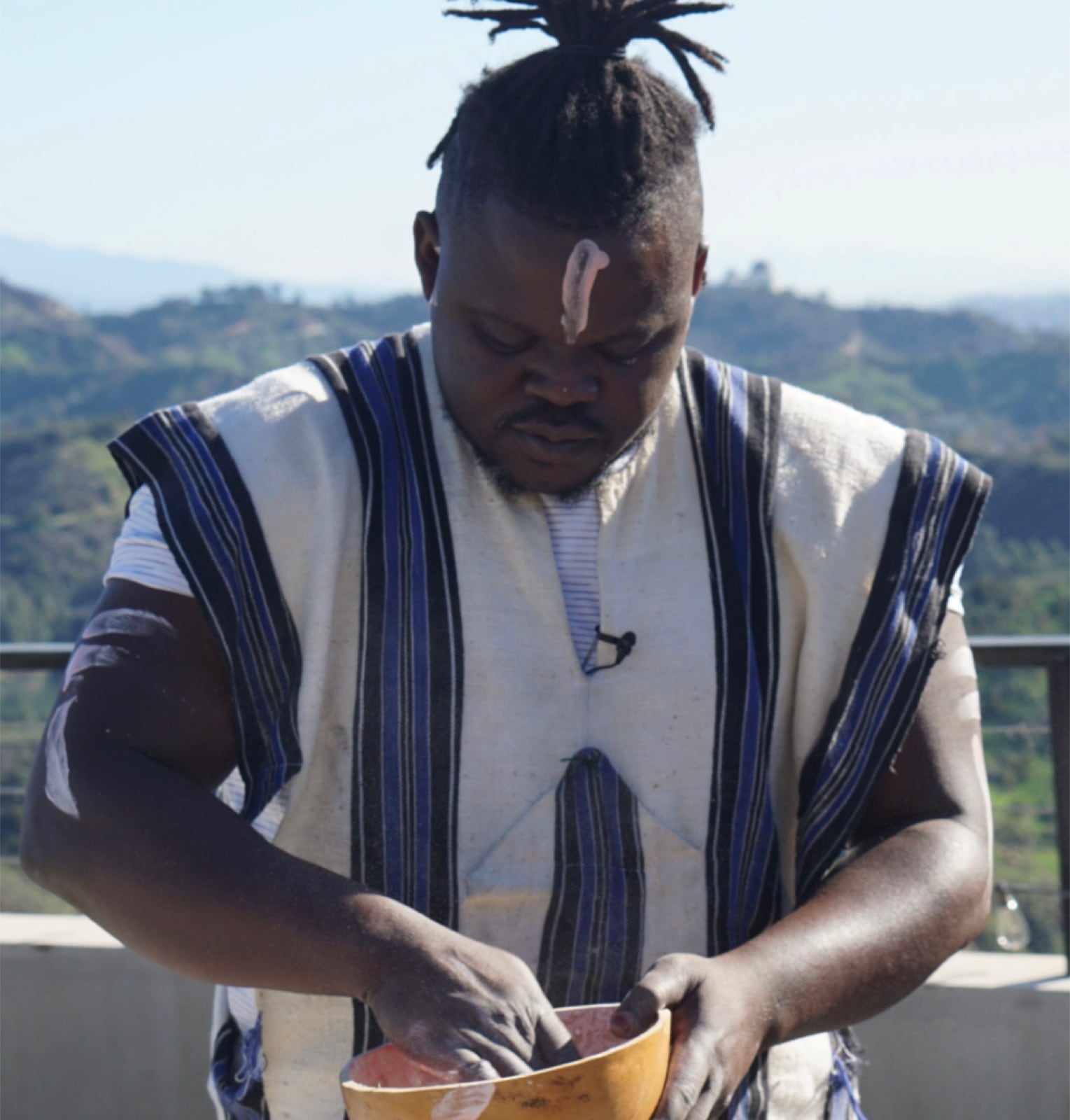 Iritah Naba Shenmira preparing for an Indigenous ceremony